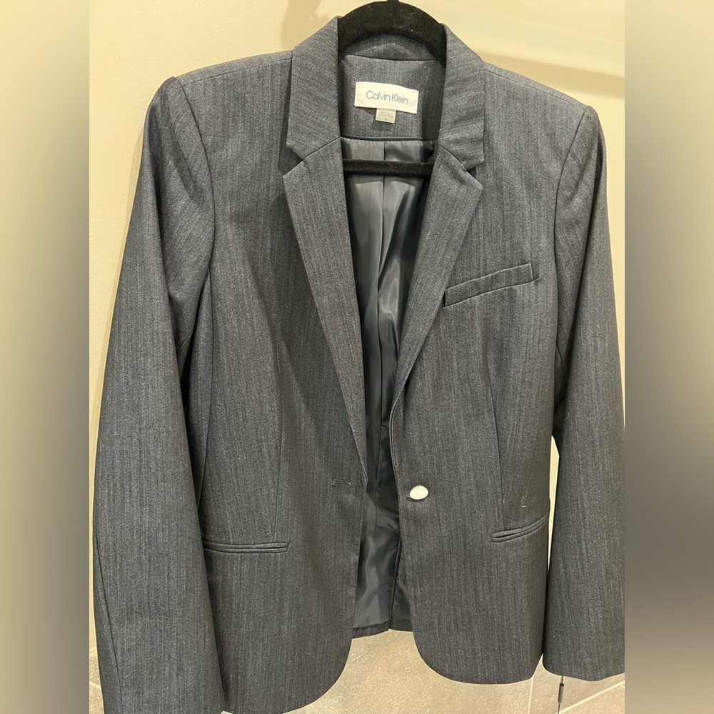 Calvin Klein blazer. New with tags. Deep blue with subtle striping pattern.